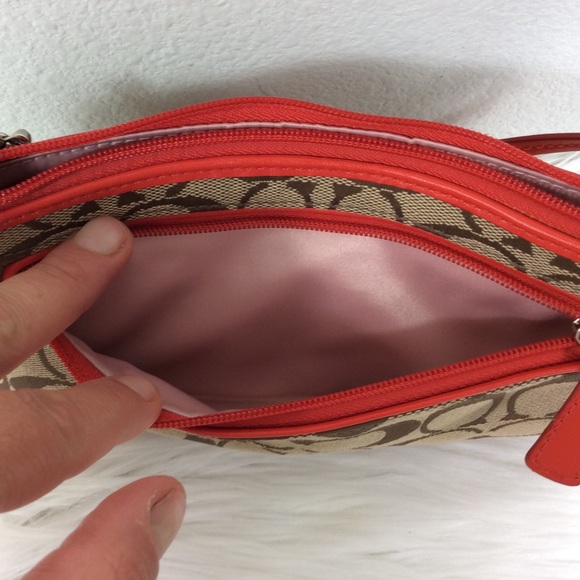 Coach logo wristlet accented with a deep orange. - Picture 5 of 7